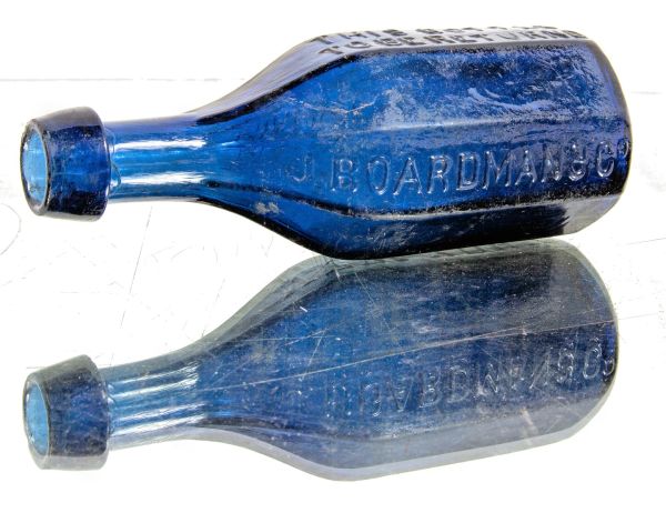 Premium Photo | Three decorative, blue bottles in sunlight.decor.