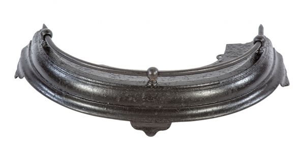 original and intact black enameled 19th century antique american victorian era curved cast iron interior residential fireplace fender with fanciful three-legged base