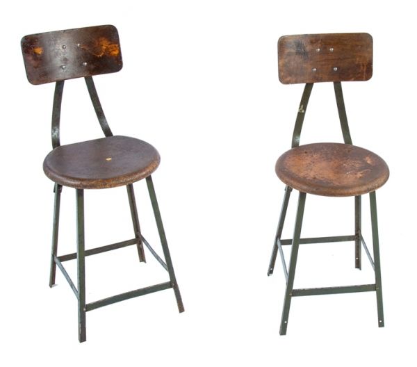 two matching original c. 1940's american industrial angled steel chicago factory machine shop four-legged stools with "pollard green" enameled finish 