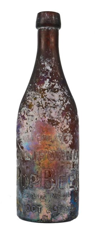 original oversized late 1870's or early 1880's chicago privy dug amber heavily iridized glass "california pops" beer bottle manufactured for s. geer in chicago, il. 