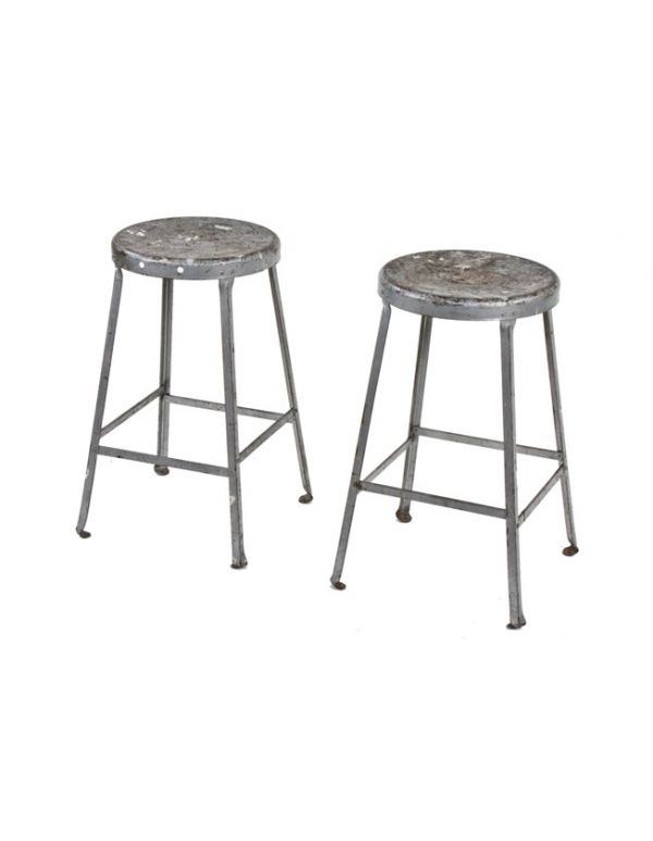 two identical original c. late 1930's vintage industrial heavy gauge angled steel factory shop stools with original paint 