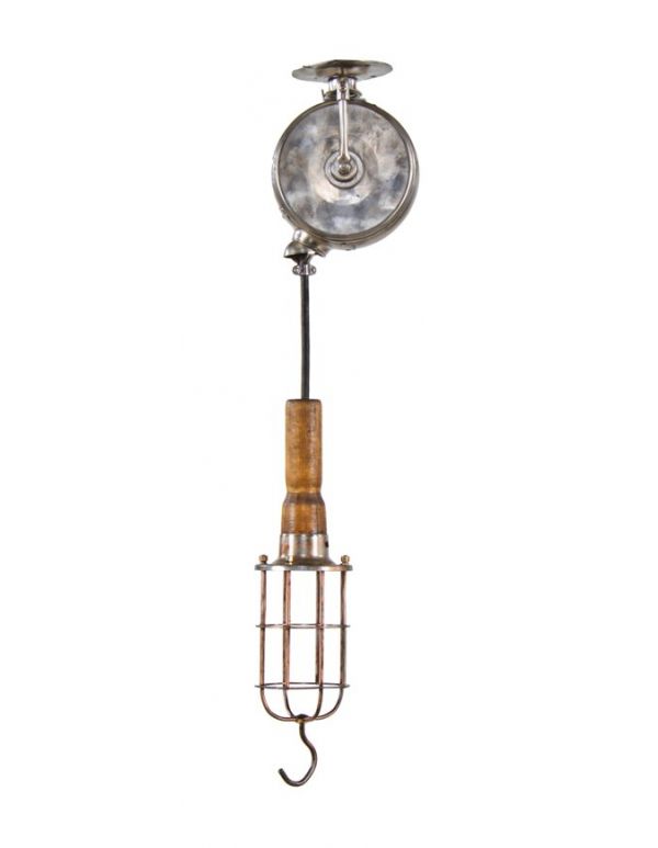 original and intact 1920's antique american industrial ceiling-mount "reelite" drop-down trouble light or lamp with turned wood handle and copper-plated cage or bulb guard