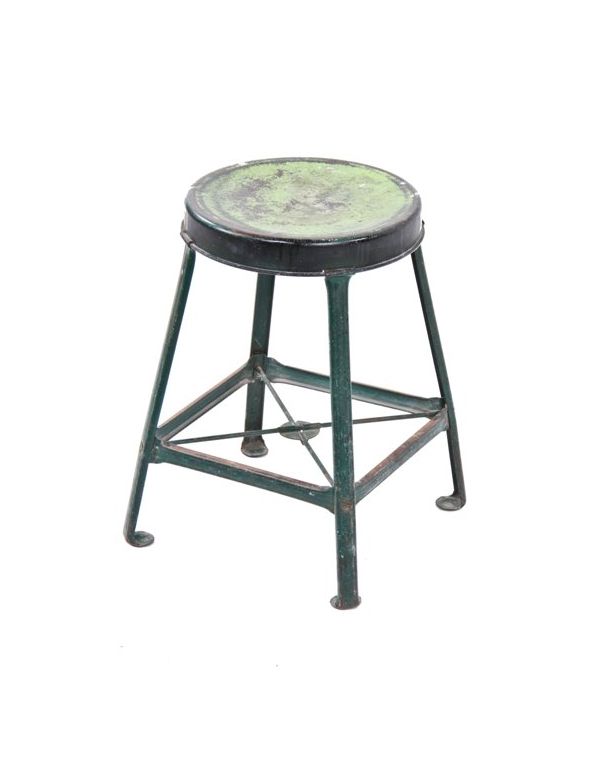original and intact low-lying green enameled pressed and folded "royal chicago" steel four-legged stool with ball-turned feet