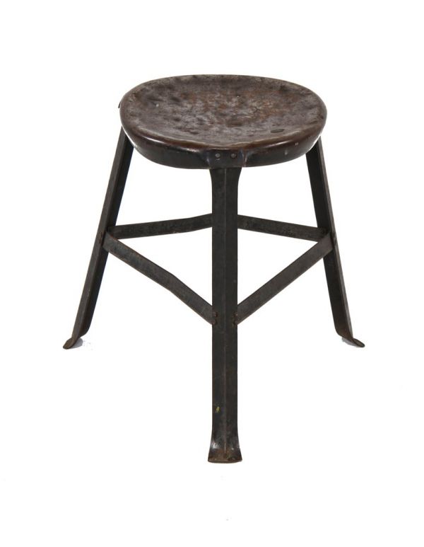 heavily worn original c. early 1940's vintage american industrial riveted joint three-legged factory machine shop stool with old backed black enameled finish