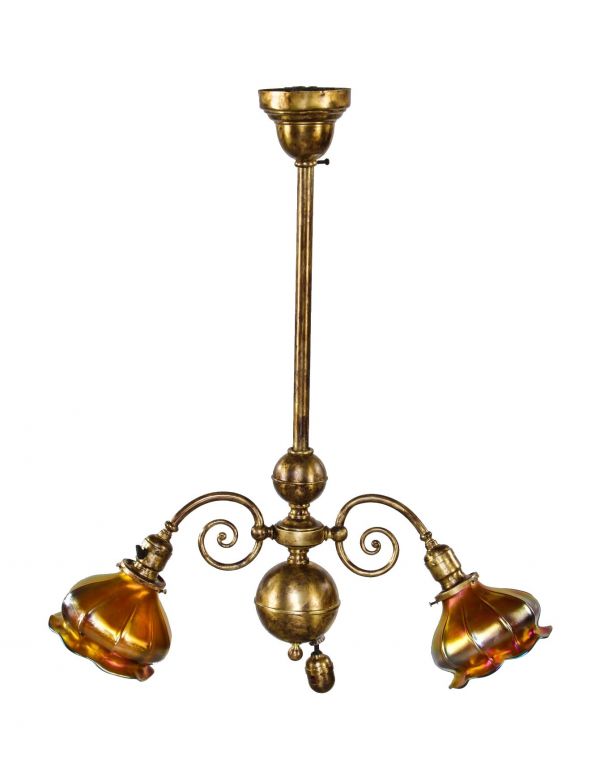 american c. early 20th century ornamental wrought yellow brass two-arm chicago athletic club billiard room ceiling fixture with gold aurene steuben shades 