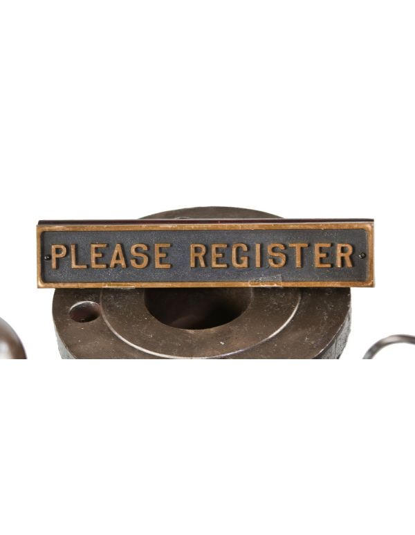original and intact late 1930's american freestanding hotel desk "please register" cast bronze sign affixed to an angled solid walnut wood base