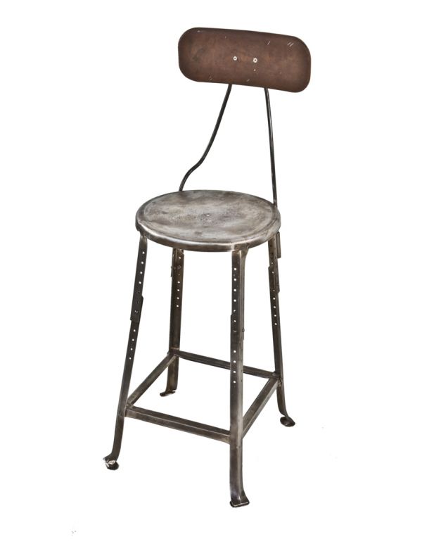 c. late 1920's original american industrial adjustable height pressed and folded brushed and sanded steel factory workman's stool with backrest 