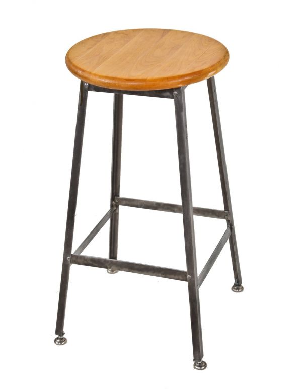 stationary c. 1950's angled iron factory machine shop pollard stool with brushed riveted joint base and refinished solid maple wood circular-shaped seat