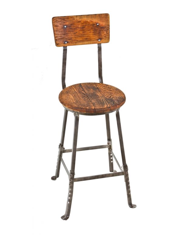 fully adjustable c. 1920's original industrial four-legged oak wood and angled steel freestanding factory machinist stool with intact wood backrest 