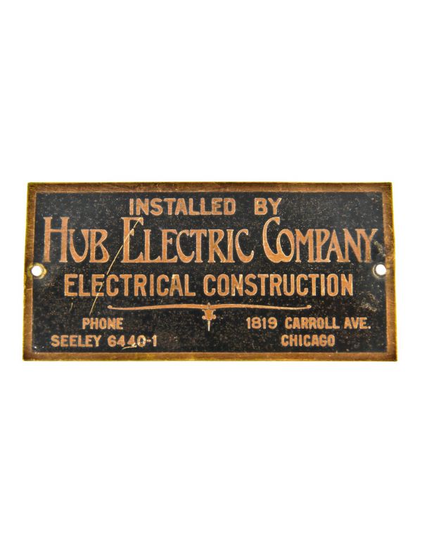 original american depression-era single-sided stamped brass paradise theater (non-extant) hub electric manufacturer plaque with black enameled background