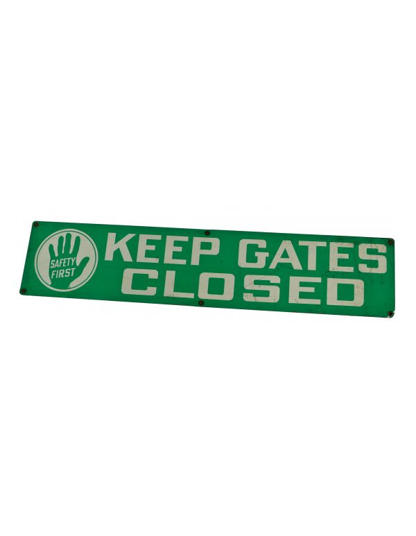 original single-sided baked-on green enameled "keep gates closed" safety first sign salvaged from a standard oil (of indiana) factory 