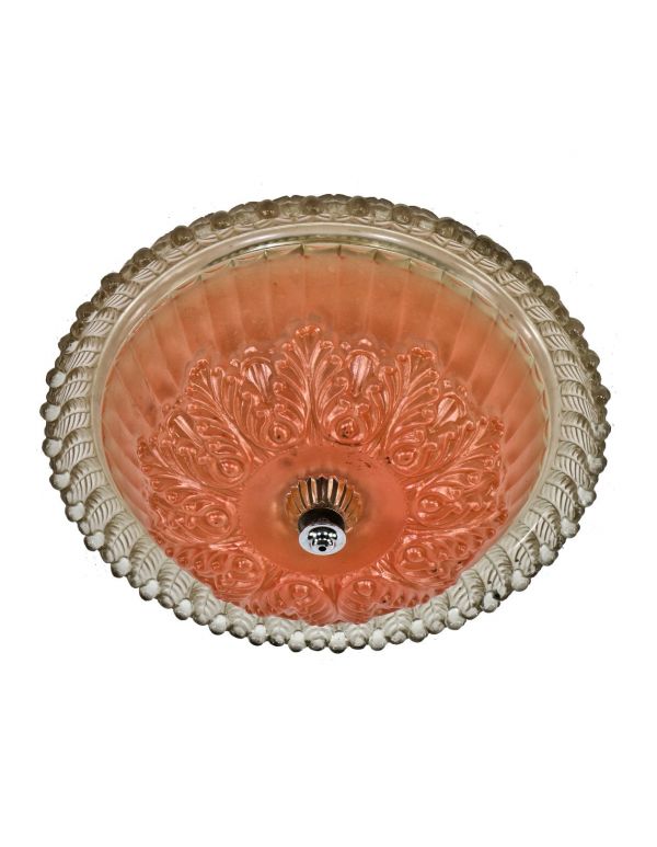 original c. 1940's elaborately designed pressed ornamental glass interior residential ceiling mount double-socket light fixture with salmon colored baked enameled finish 