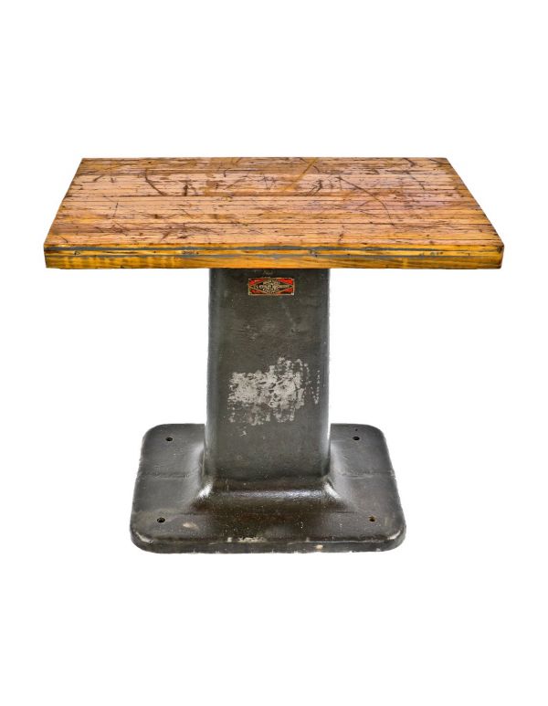 original antique american industrial heavy duty repurposed cast iron factory machine shop base with a newly added weathered and worn maple wood butcher block top