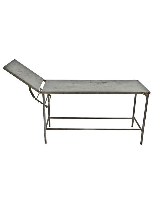 c. 1920's all original and intact fully adjustable pressed and folded steel cook county hospital operating room examination room table with tubular steel legs