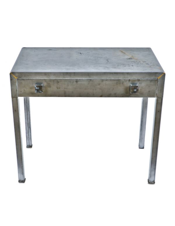 highly sought after all original robust pressed and folded steel four-legged simmons desk with single pull-out drawer retaining original drawer pulls