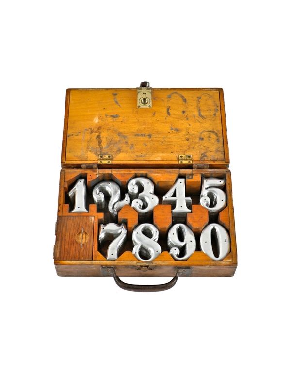 rare early 20th century antique american industrial "new old stock" stamped metal residential or commercial address numbers with box and nails