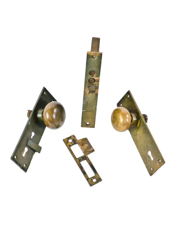 original and fully functional c. 1880's unornamented cast bronze salvaged chicago entrance door lockset with screwless spindles and swinging keyhole cover