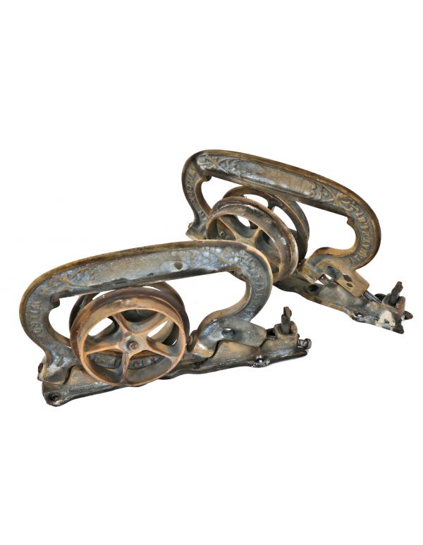 late 19th century hard to find original interior residential ornamental cast iron single pocket door brackets or hangers with rollers and base plates