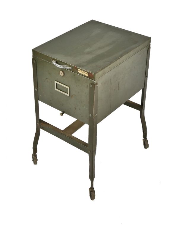 original c. 1940's fully functional mobile factory four-legged office file folder storage cabinet with hinged top and bassick casters