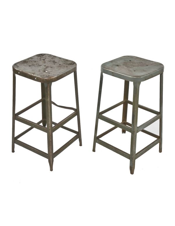 two matching c. 1950's gunship gray enameled salvaged chicago factory pressed and folded steel lyon stools with nicely aged patina 