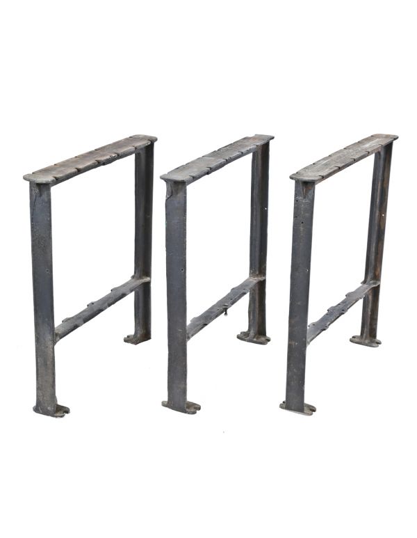 three matching original depression era antique american industrial cast iron chicago factory workbench table bases or legs with outswept feet