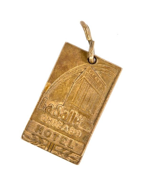 original double-sided american depression era chicago lasalle hotel key fob with nicely aged surface patina