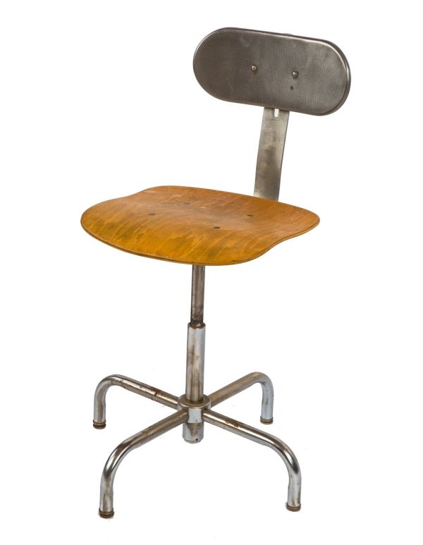 original fully adjustable refinished vintage american industrial bent tubular steel stationary stool with maple wood saddle seat and slightly contoured metal backrest 
