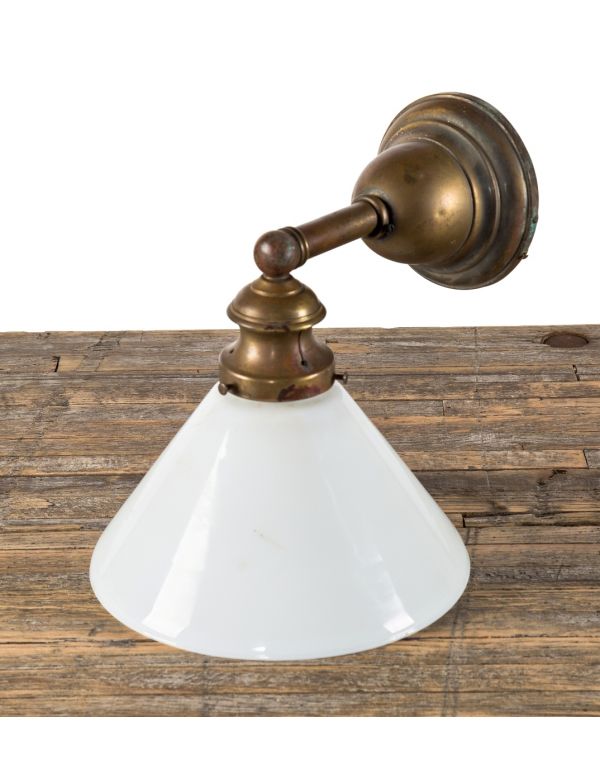 single early 20th century simple and elegant nicely aged brass residential or commercial wall sconce with intact white glass shade or reflector 