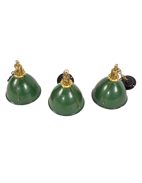 three matching c. 1930's antique american industrial green porcelain enameled deep bowl reflector pendant light fixtures with chain and black enameled canopies 