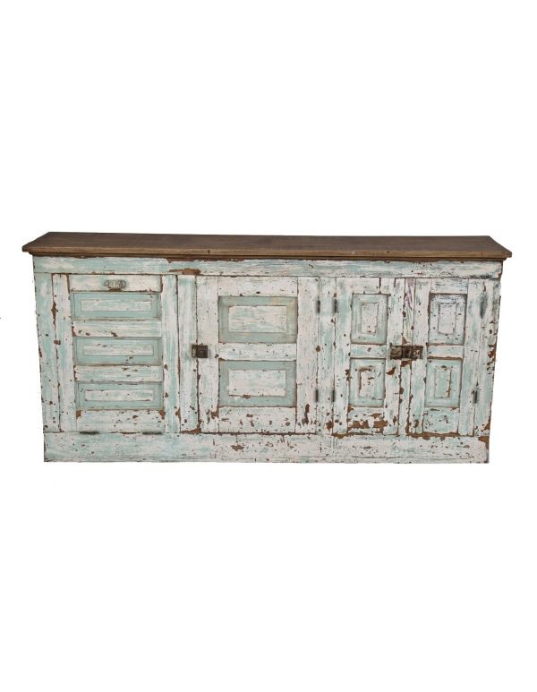 late 19th or early 20th century country store compartmentalized oak wood counter or side table with weathered ans worn painted finish throughout