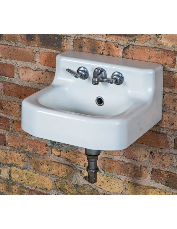 original early 20th century wall-mount white porcelain enameled cast iron salvaged chicago residential sink with chrome-plated hot and cold faucet handles 