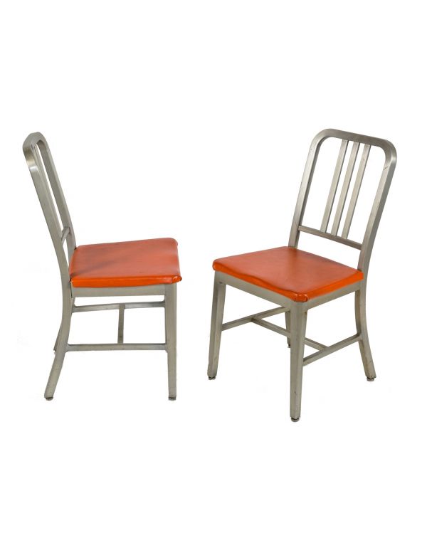 matching set of vintage midcentury modern salvaged chicago factory office brushed aluminum steel case side chairs with original orange foam-cushioned cushions