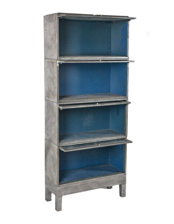one of two nearly identical refinished freestanding pressed and folded steel barrister bookcase with drop-down doors 