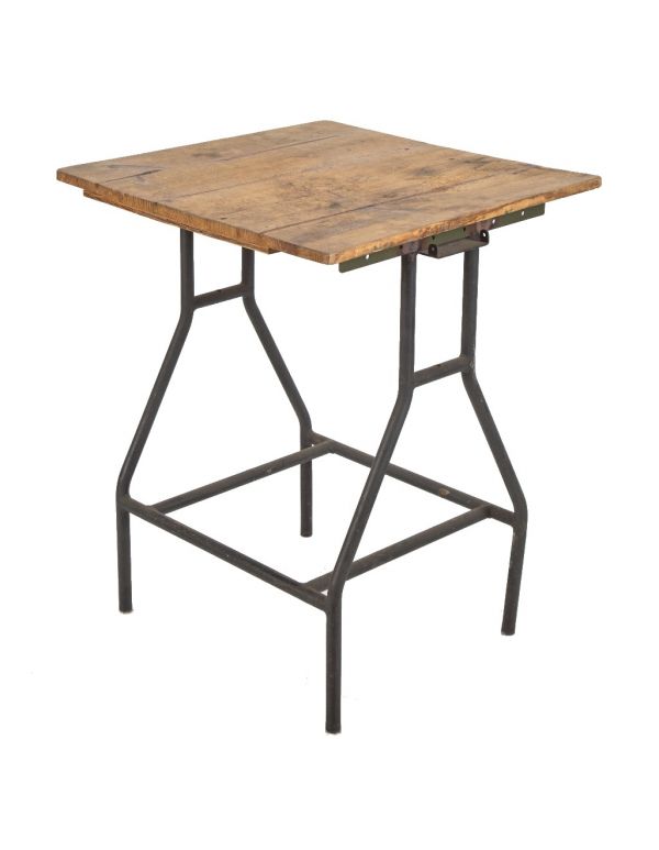 unusual customized welded joint tubular steel four-legged industrial table with weathered pine wood tabletop 