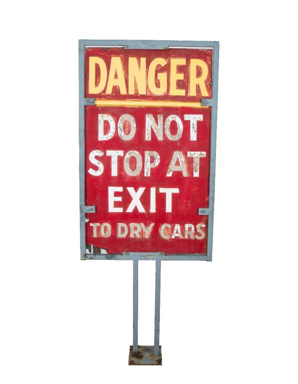 oversized custom-built salvaged chicago star car wash "danger" sign with welded-joint metal stand and bold lettering 