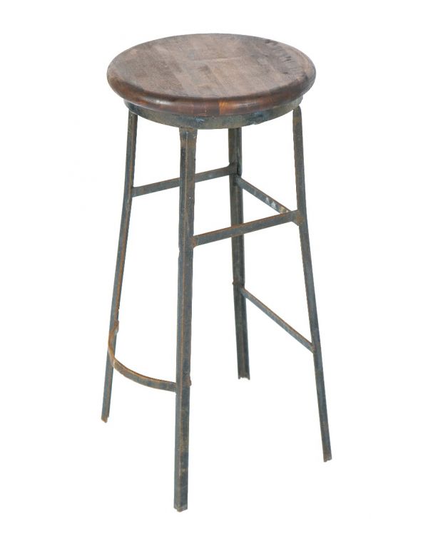 depression-era original american industrial machinist's stool with riveted joint steel base and solid maple wood seat