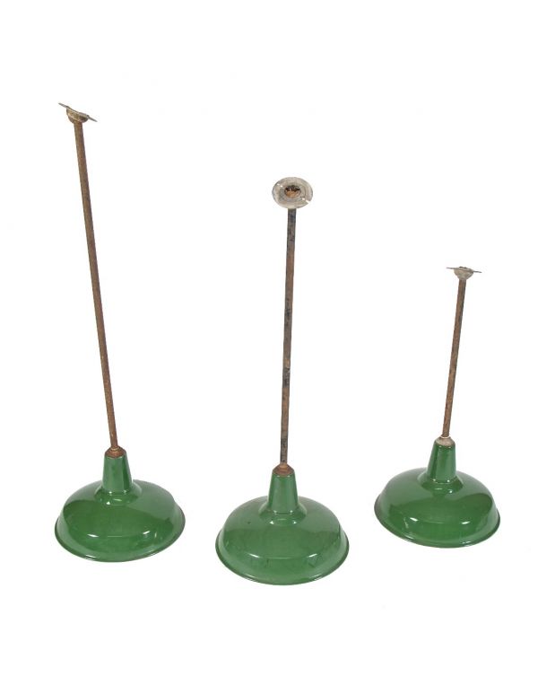 group of three vintage industrial green porcelain enameled factory machine shop pendant lights 