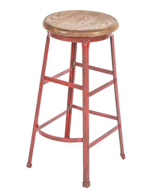 original salvaged chicago depression-era four-legged angled steel stool with riveted joints and solid oak wood seat