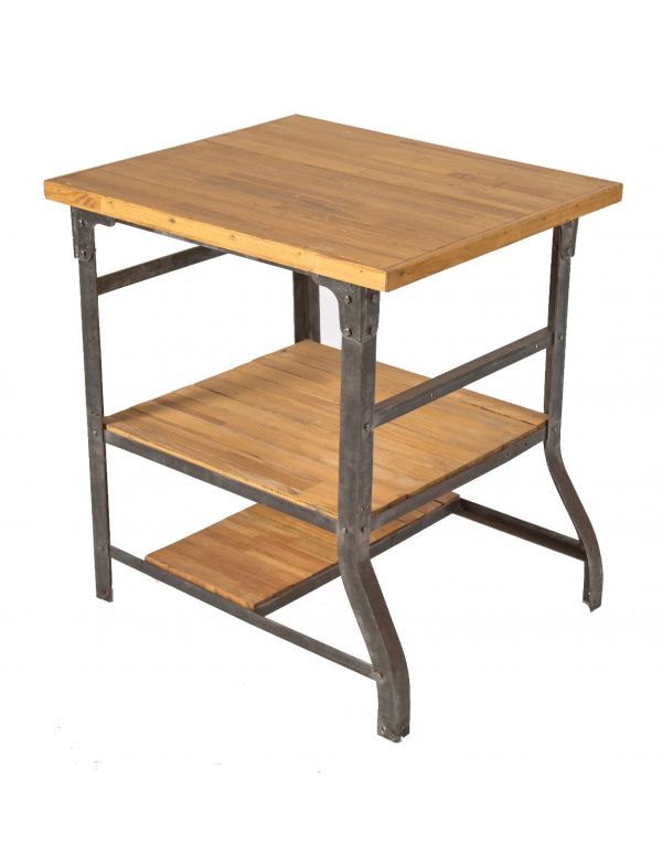unique early american industrial riveted joint angled steel factory table or work station with three-tiers