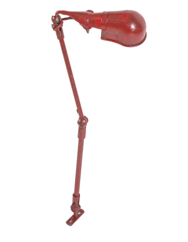 all original and fully functional triple-jointed weathered and worn red enameled fostoria factory machine shop bench lamp