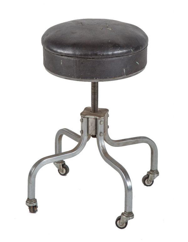 fully adjustable four-legged c. 1940's royal metal metal four-legged bent tubular steel stool with original casters 