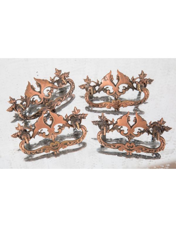 tweleve matching original late 19th or early 20th century copper-plated cast brass victorian drawer pulls