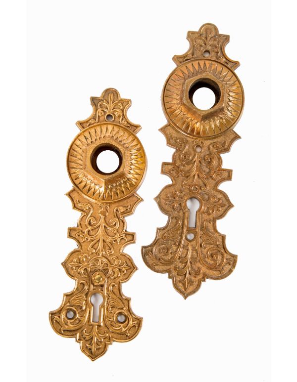 two matching 1870s high victorian-era ornamental cast bronze interior residential compression cast doorknob backplates 
