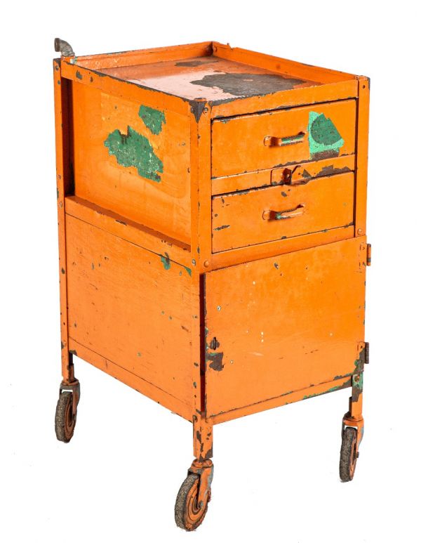 original vintage american industrial salvaged chicago weathered and worn orange painted pressed and folded steel lyon tool stand or cabinet with swivel casters 