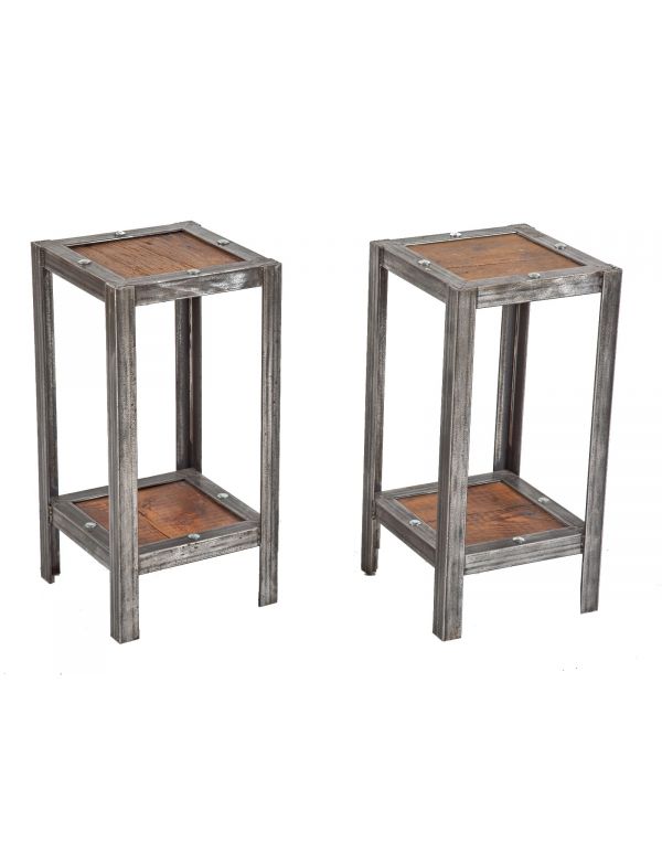 matching set of custom-built vintage industrial heavy duty welded joint angled steel side tables with old growth wood shelves