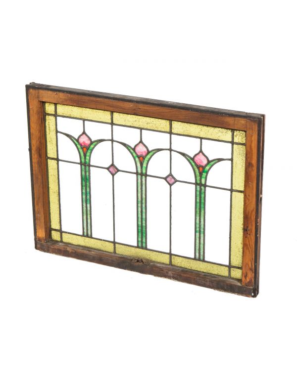 single early 20th century prairie style leaded glass window with three repeating abstract floral motifs with a rectilinear grid