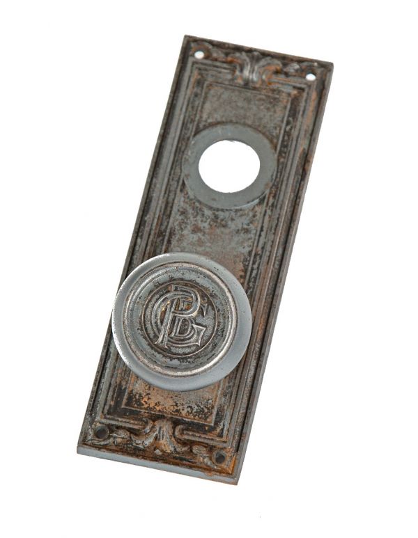 historically important early 20th century ornamental cast iron monogrammed d.h. burnham's peoples gas building door hardware   