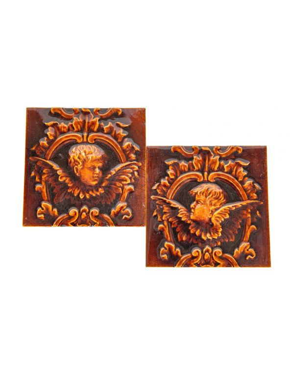 two highly sought after reddish-brown majolica glazed 19th century salvaged chicago figural winged cherub majolica fireplace tiles 