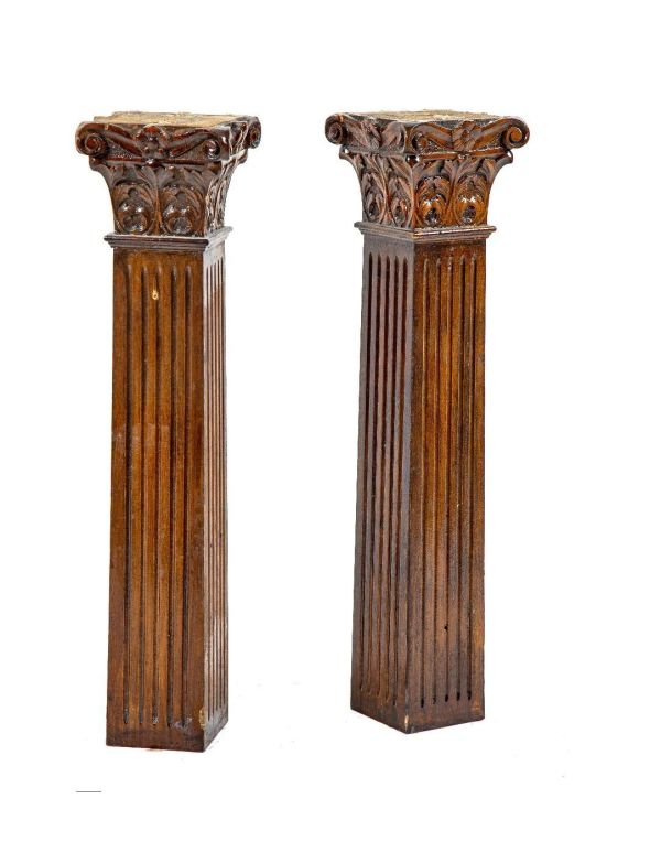 two matching 19th century solid cherry diminutive wood columns with hand-carved capitals