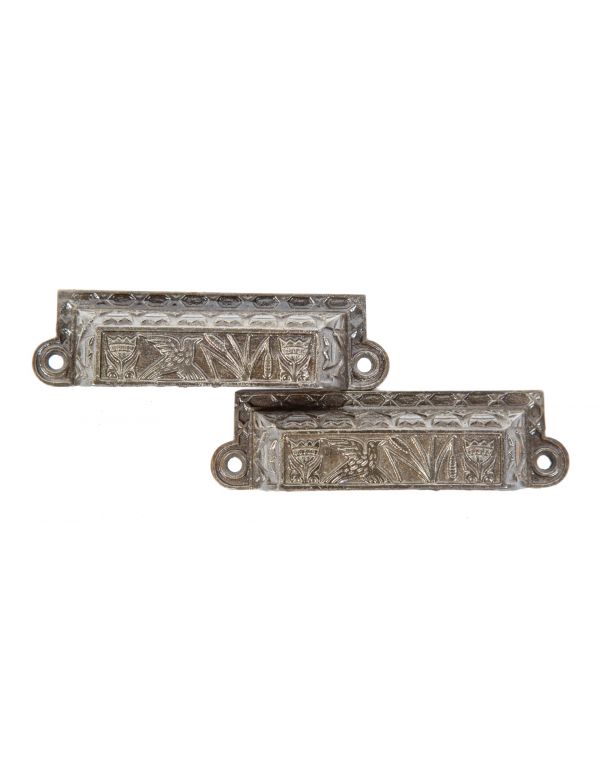 two matching original 1880s ornamental cast iron figural anglo-japanese residential cabinet drawer pulls with brushed metal finish 